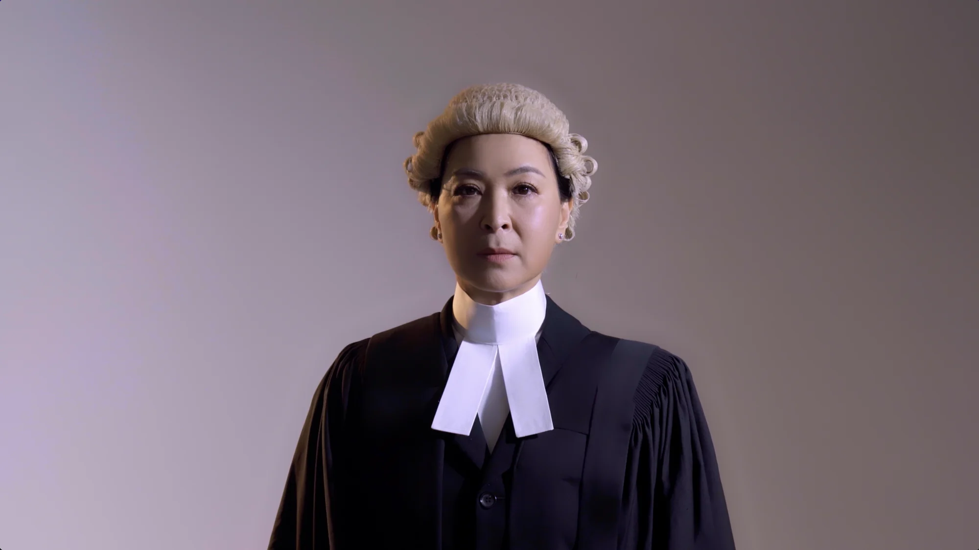 Creator-provided Prima Facie promotional frame with the performer in courtroom costume.